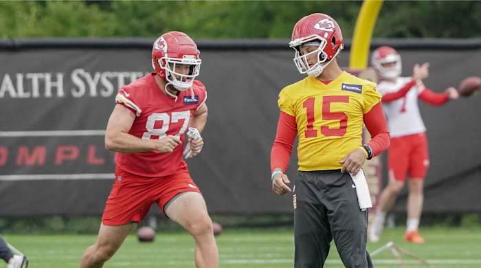 May 26, 2022; Kansas City, MO, USA; Kansas City Chiefs quarterback Patrick Mahomes (15) and tight end Travis Kelce (87) run drills during organized team activities at The University of Kansas Health System Training Complex.